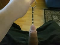 Horny guy pulls long beaded chain from his cock.
